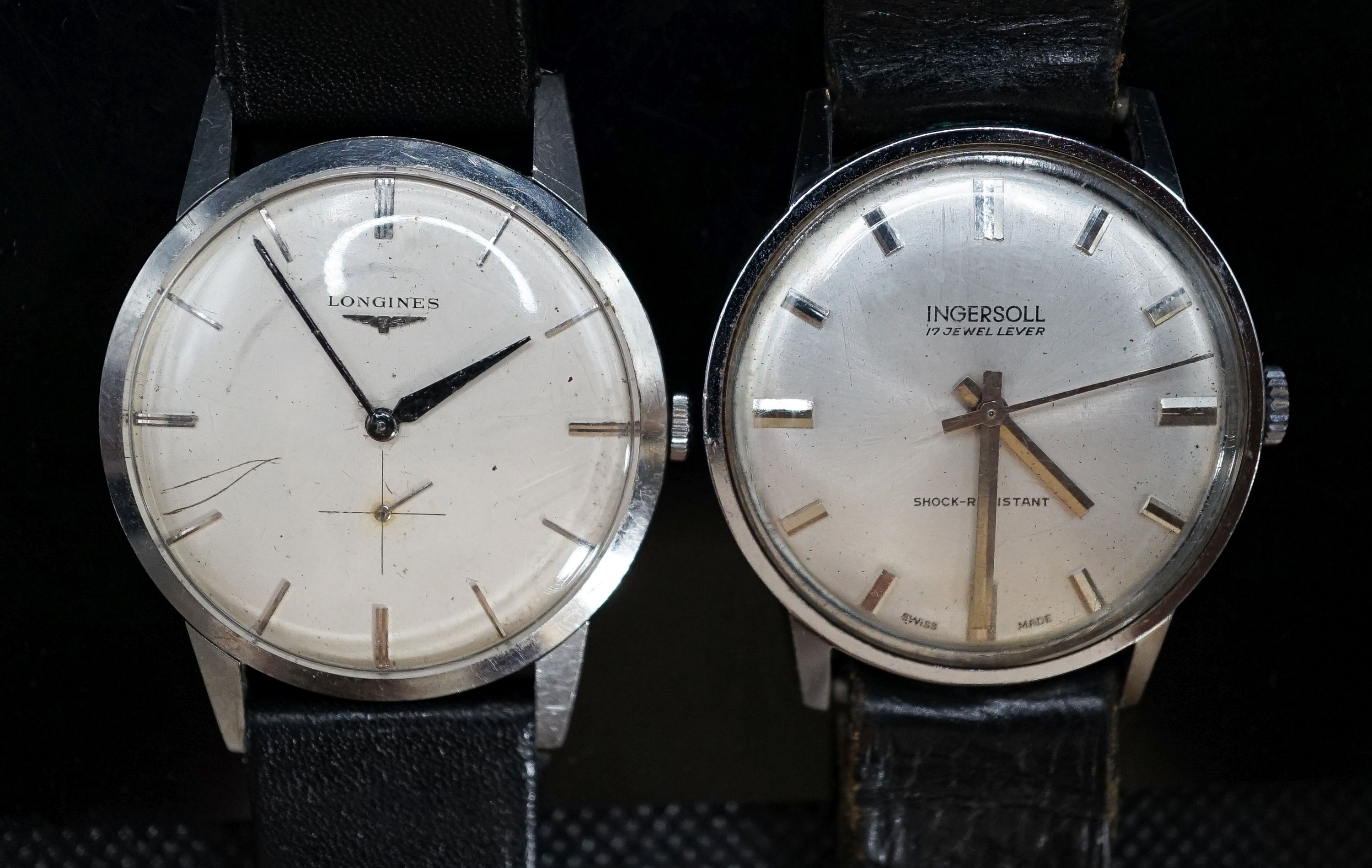 A gentleman's stainless steel Longines manual wind wrist watch, cased diameter 35mm and a similar Ingersol watch.